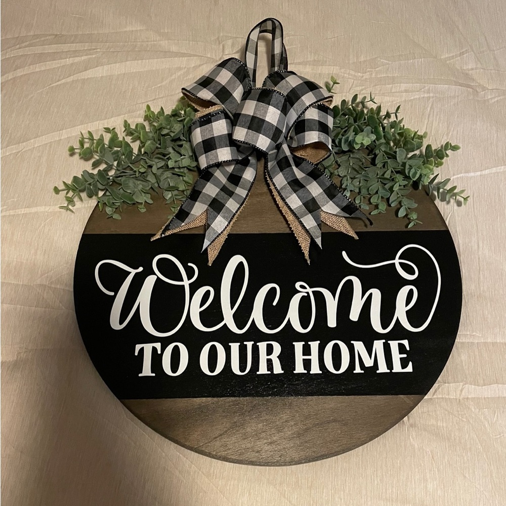 Wooden door hanger with black and white ribbon